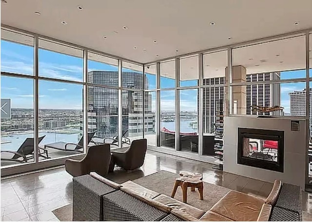 75 Wall St Unit 26J, New York Manhattan, NY 10005 - common area with a wall of windows, a view of city, and a water view