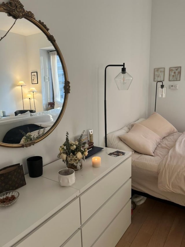 75 Wall St Unit 26J, New York Manhattan, NY 10005 - bedroom featuring dark wood-type flooring