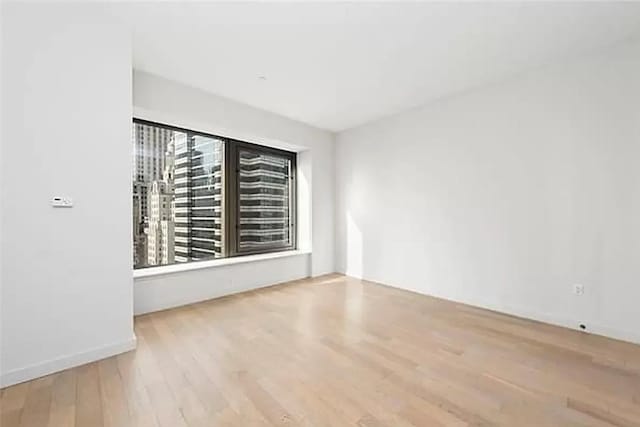 75 Wall St Unit 26J, New York Manhattan, NY 10005 - unfurnished room with wood finished floors