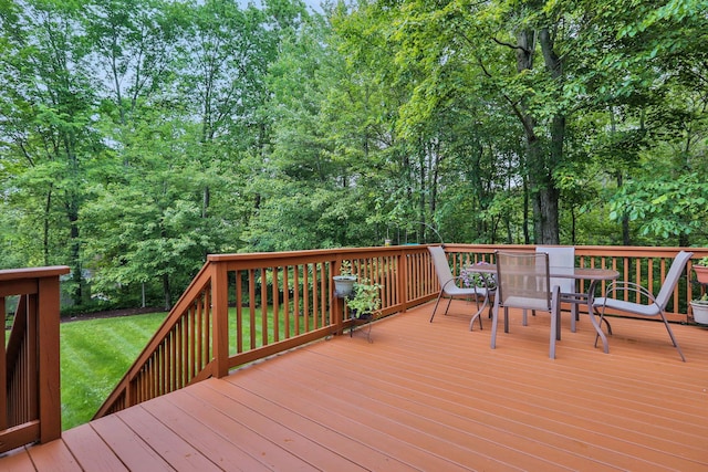 390 Lakeside Rd, Newburgh, NY 12550 - wooden deck with outdoor dining area and a lawn