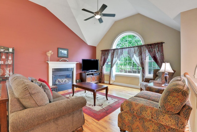 390 Lakeside Rd, Newburgh, NY 12550 - living room with ceiling fan, a fireplace with flush hearth, light wood-style flooring, and lofted ceiling