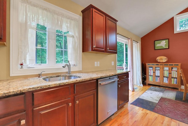 390 Lakeside Rd, Newburgh, NY 12550 - kitchen with stainless steel dishwasher, light wood-style flooring, a sink, lofted ceiling, and light stone countertops