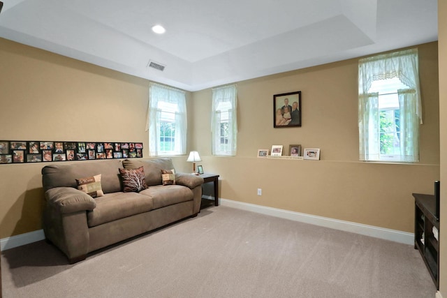 390 Lakeside Rd, Newburgh, NY 12550 - carpeted living room featuring a tray ceiling, baseboards, and recessed lighting