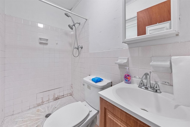 218 Johnson Rd, Wingdale, NY 12594 - bathroom featuring a tile shower, vanity, toilet, and tile walls