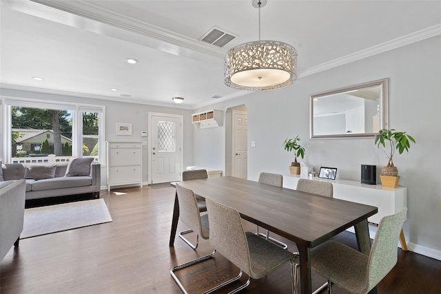 61 Tamarack Rd, Rye Brook, NY 10573 - dining space with ornamental molding, wood finished floors, baseboards, recessed lighting, and arched walkways