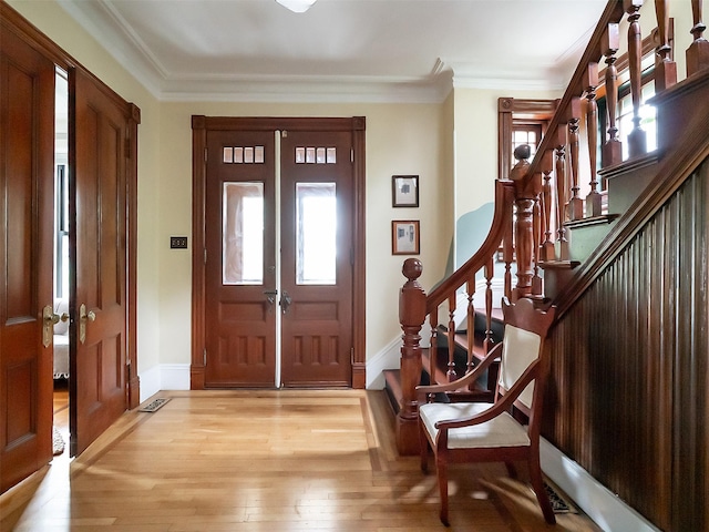 511 Grand Ave, Newburgh, NY 12550 - foyer featuring light wood-style floors, stairs, crown molding, and baseboards