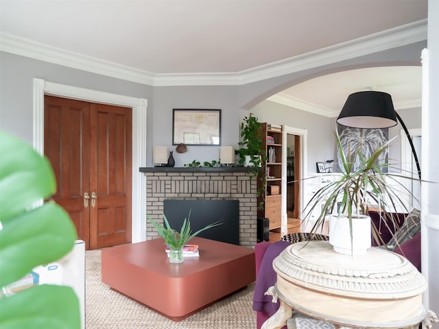 511 Grand Ave, Newburgh, NY 12550 - living area featuring a brick fireplace, arched walkways, and ornamental molding