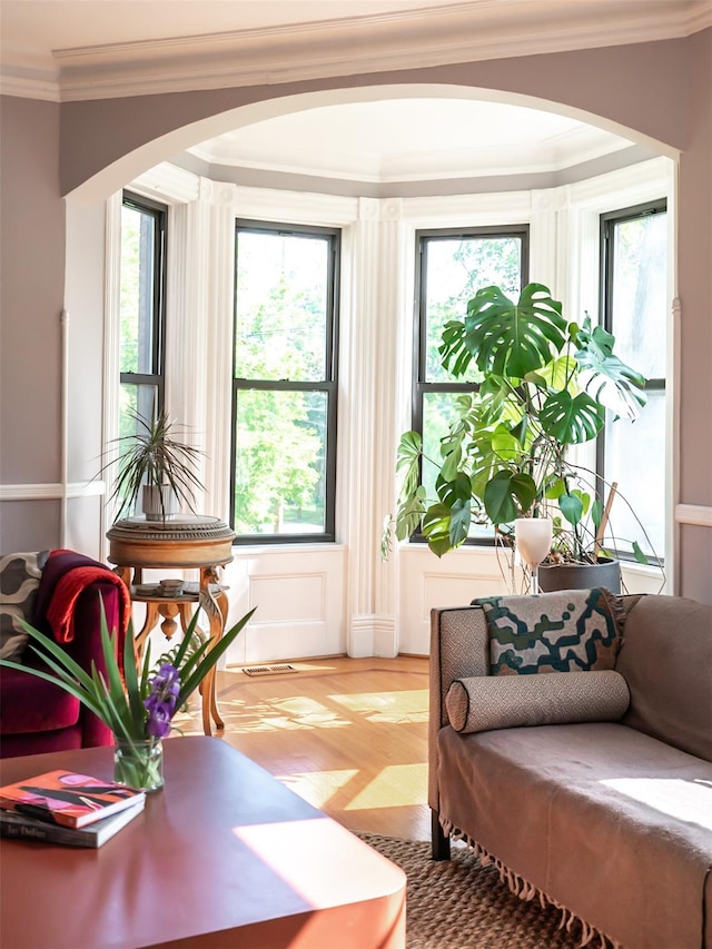 511 Grand Ave, Newburgh, NY 12550 - sitting room with arched walkways, crown molding, and healthy amount of natural light
