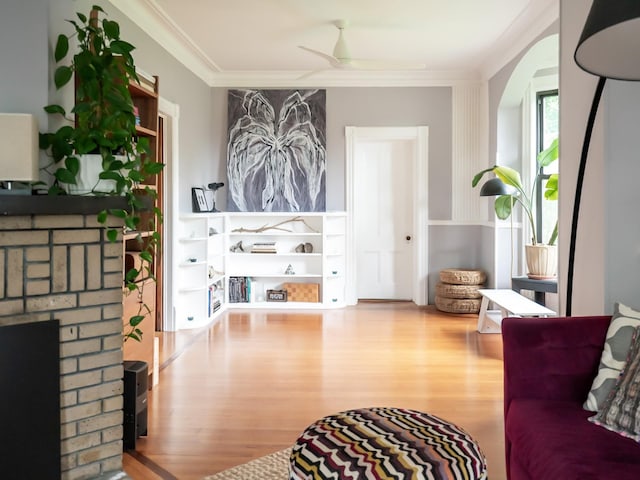 511 Grand Ave, Newburgh, NY 12550 - living area featuring wood finished floors, ornamental molding, a fireplace, and ceiling fan