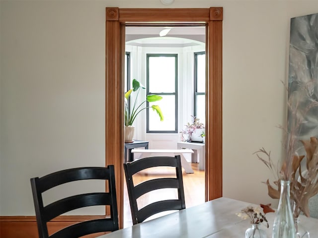 511 Grand Ave, Newburgh, NY 12550 - dining area featuring arched walkways and wood finished floors