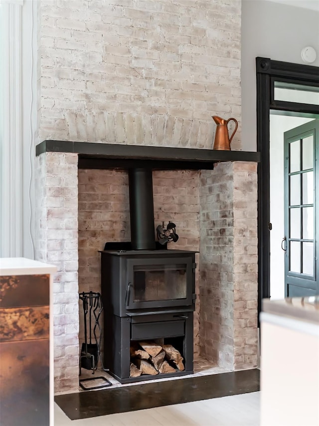 511 Grand Ave, Newburgh, NY 12550 - detailed view of a wood stove, a smoke detector, and brick wall