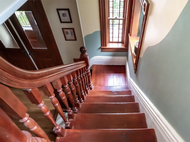 511 Grand Ave, Newburgh, NY 12550 - stairway featuring plenty of natural light, wood finished floors, and baseboards