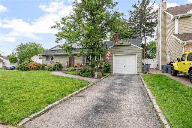 3363 Emeric Ave, Wantagh, NY 11793 - single story home featuring a chimney, a garage, driveway, roof mounted solar panels, and central AC