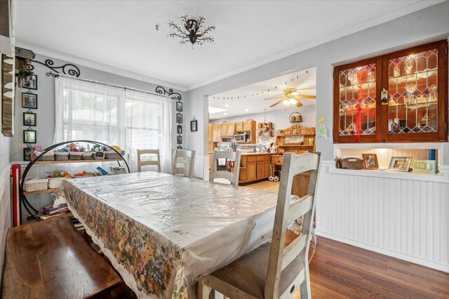 3363 Emeric Ave, Wantagh, NY 11793 - dining room with ornamental molding, light wood-type flooring, and a ceiling fan