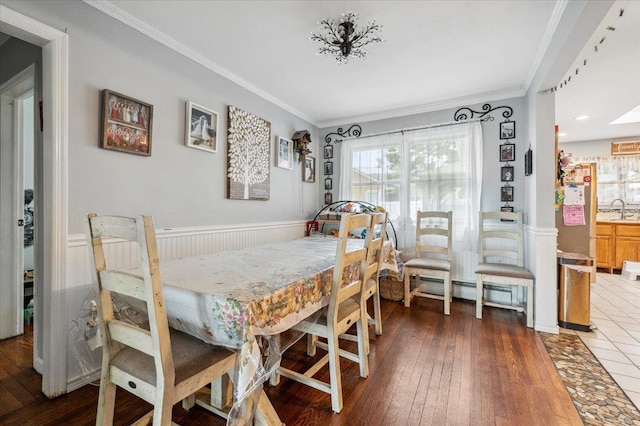 3363 Emeric Ave, Wantagh, NY 11793 - dining room with wainscoting, crown molding, and wood-type flooring