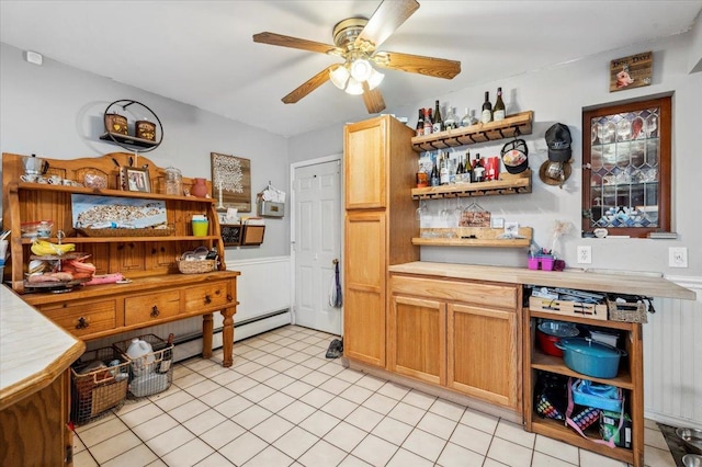 3363 Emeric Ave, Wantagh, NY 11793 - kitchen with open shelves, light countertops, ceiling fan, a wainscoted wall, and baseboard heating