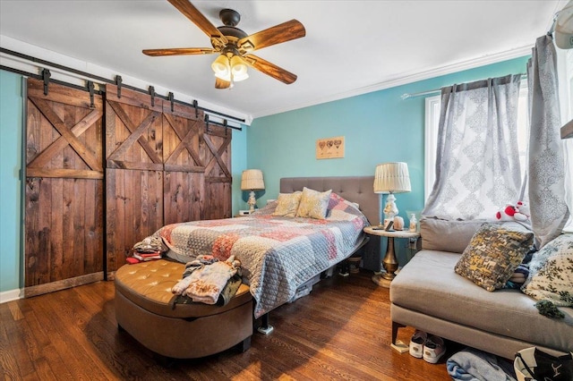 3363 Emeric Ave, Wantagh, NY 11793 - bedroom with a barn door, wood finished floors, ornamental molding, and ceiling fan