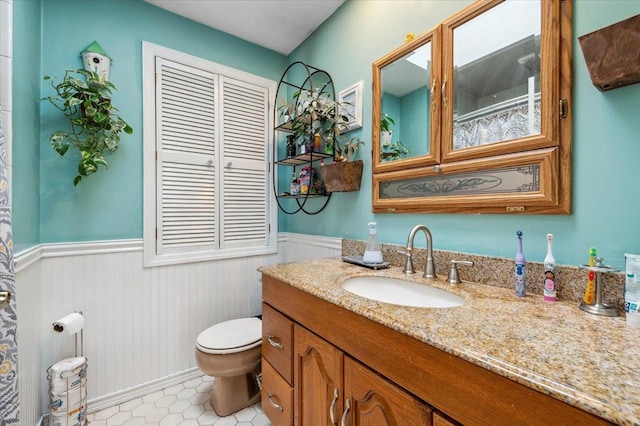 3363 Emeric Ave, Wantagh, NY 11793 - full bath with a wainscoted wall, toilet, and vanity