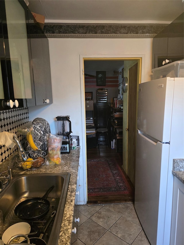 86-70 Francis Lewis Unit A55, Holliswood, NY 11427 - kitchen featuring freestanding refrigerator, light tile patterned flooring, and stone counters