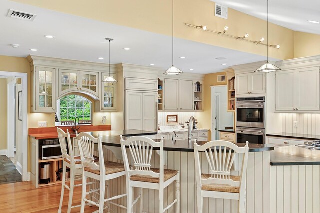 2 Shady Meadow Ln, Syosset, NY 11791 - kitchen with open shelves, stainless steel double oven, dark countertops, decorative backsplash, and recessed lighting