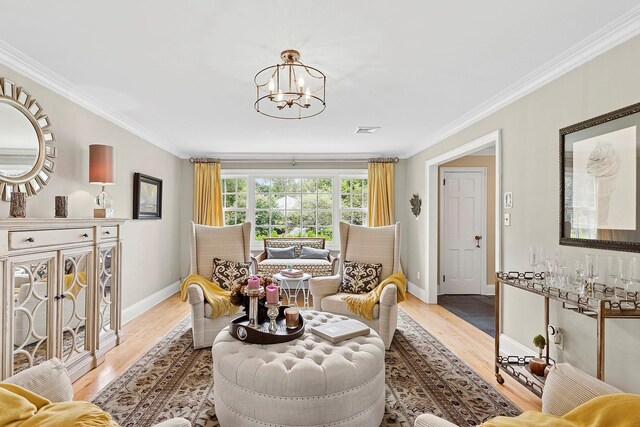 2 Shady Meadow Ln, Syosset, NY 11791 - living area with light wood-type flooring, ornamental molding, baseboards, and a chandelier
