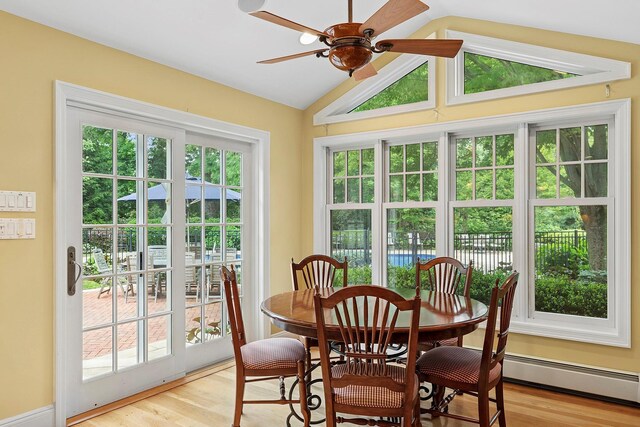 2 Shady Meadow Ln, Syosset, NY 11791 - dining space featuring vaulted ceiling, a ceiling fan, light wood-type flooring, and baseboard heating