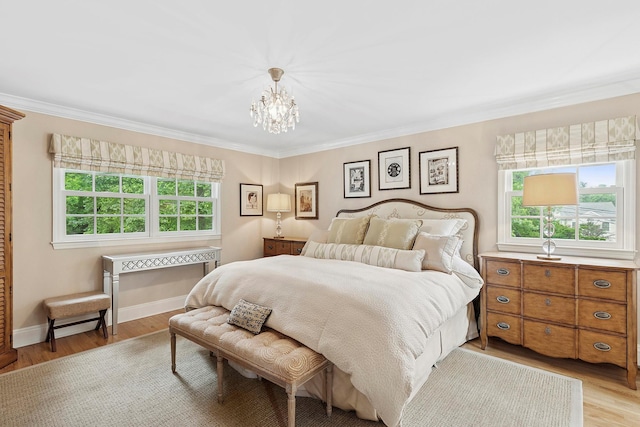 2 Shady Meadow Ln, Syosset, NY 11791 - bedroom with light wood-type flooring, a chandelier, crown molding, and baseboards