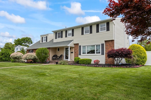 6 W Shore Rd, Bay Shore, NY 11706 - view of front of home featuring a front lawn and brick siding