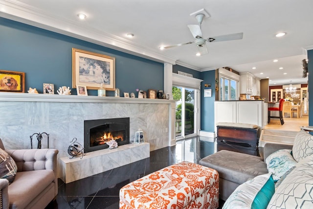 6 W Shore Rd, Bay Shore, NY 11706 - living room featuring granite tiled floors, a high end fireplace, recessed lighting, ornamental molding, and ceiling fan