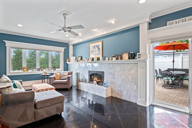 6 W Shore Rd, Bay Shore, NY 11706 - living room featuring plenty of natural light, granite tiled floors, ornamental molding, a ceiling fan, and a fireplace