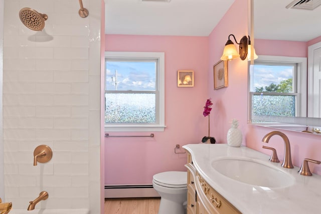 6 W Shore Rd, Bay Shore, NY 11706 - full bathroom featuring a baseboard heating unit, vanity, a shower, toilet, and wood finished floors