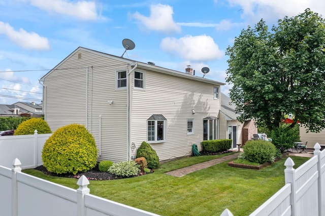 6 W Shore Rd, Bay Shore, NY 11706 - view of side of home with a chimney