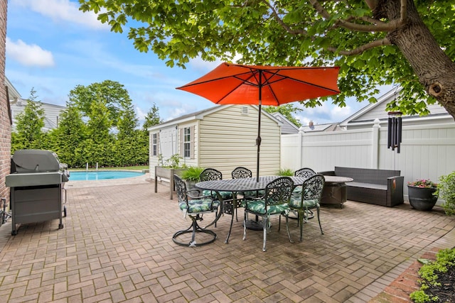 6 W Shore Rd, Bay Shore, NY 11706 - view of patio featuring an outdoor pool, outdoor dining area, and a grill