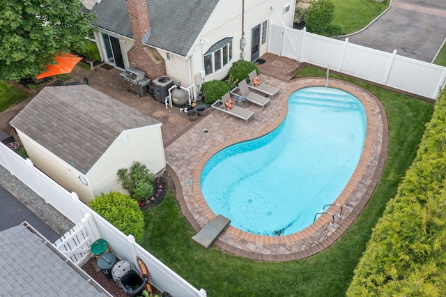 6 W Shore Rd, Bay Shore, NY 11706 - view of pool with grilling area, a patio area, and a fenced backyard