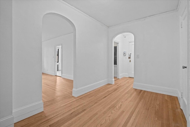 20 William St Unit 3D, Mount Vernon, NY 10552 - spare room with arched walkways, ornamental molding, light wood-style flooring, and baseboards