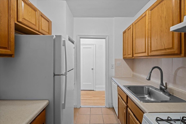 20 William St Unit 3D, Mount Vernon, NY 10552 - kitchen featuring a sink, tasteful backsplash, white appliances, light countertops, and light tile patterned flooring