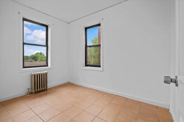 20 William St Unit 3D, Mount Vernon, NY 10552 - empty room featuring radiator, baseboards, and light tile patterned floors