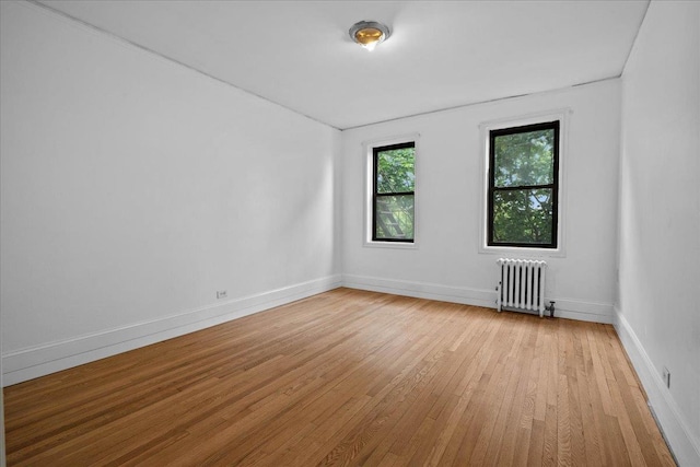20 William St Unit 3D, Mount Vernon, NY 10552 - unfurnished room featuring radiator heating unit, light wood-style floors, and baseboards