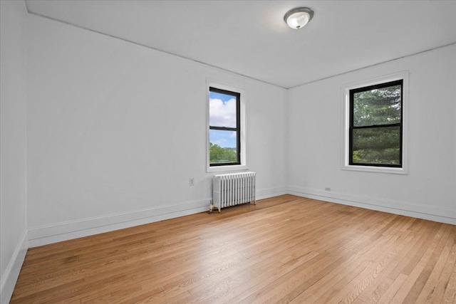 20 William St Unit 3D, Mount Vernon, NY 10552 - unfurnished room with radiator, light wood-style flooring, and baseboards