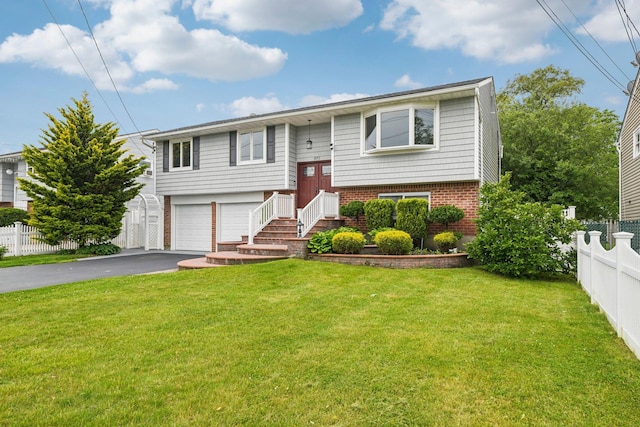 872 Main St, Farmingdale, NY 11735 - raised ranch with driveway, a garage, and brick siding