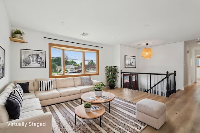 872 Main St, Farmingdale, NY 11735 - living room featuring light wood-style floors and recessed lighting