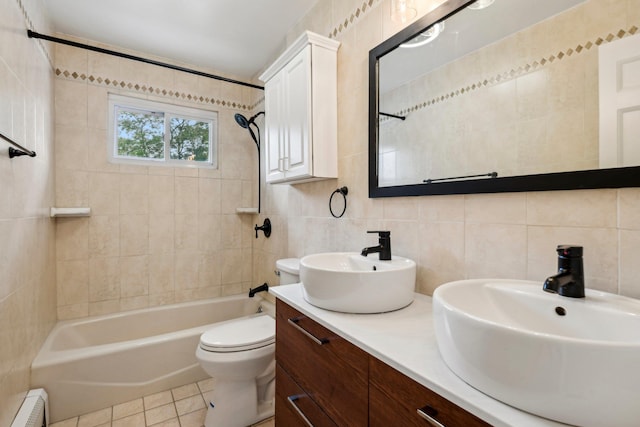 872 Main St, Farmingdale, NY 11735 - bathroom featuring tile walls, a baseboard radiator, washtub / shower combination, toilet, and double vanity