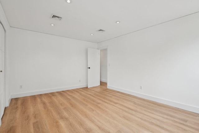 872 Main St, Farmingdale, NY 11735 - empty room featuring recessed lighting, light wood-type flooring, and baseboards