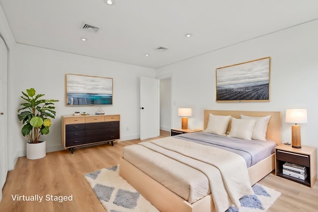 872 Main St, Farmingdale, NY 11735 - bedroom with light wood finished floors, baseboards, and recessed lighting
