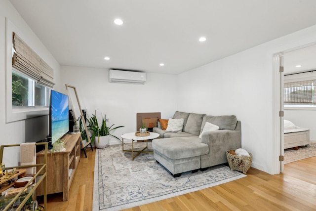 872 Main St, Farmingdale, NY 11735 - living room featuring an AC wall unit, wood finished floors, recessed lighting, and baseboards
