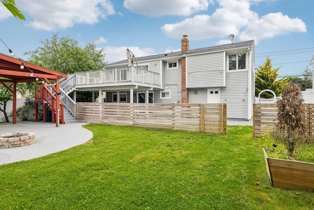 872 Main St, Farmingdale, NY 11735 - back of house featuring an outdoor fire pit, a patio, a chimney, and stairway