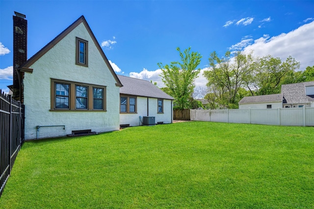 240 Tyrconnell Ave, Massapequa Park, NY 11762 - rear view of property featuring stucco siding, cooling unit, and a chimney