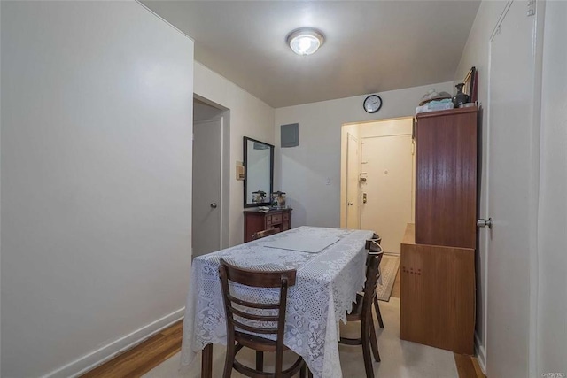 84-50 169th St Unit 606, Jamaica Hills, NY 11432 - dining area with light wood-style floors and baseboards