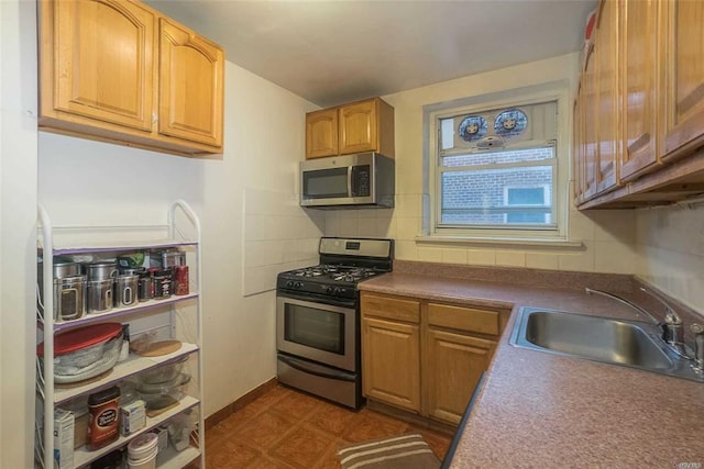 84-50 169th St Unit 606, Jamaica Hills, NY 11432 - kitchen with stainless steel appliances, a sink, tasteful backsplash, dark floors, and dark countertops