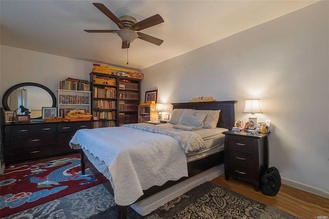 84-50 169th St Unit 606, Jamaica Hills, NY 11432 - bedroom featuring dark wood-type flooring, baseboards, and ceiling fan